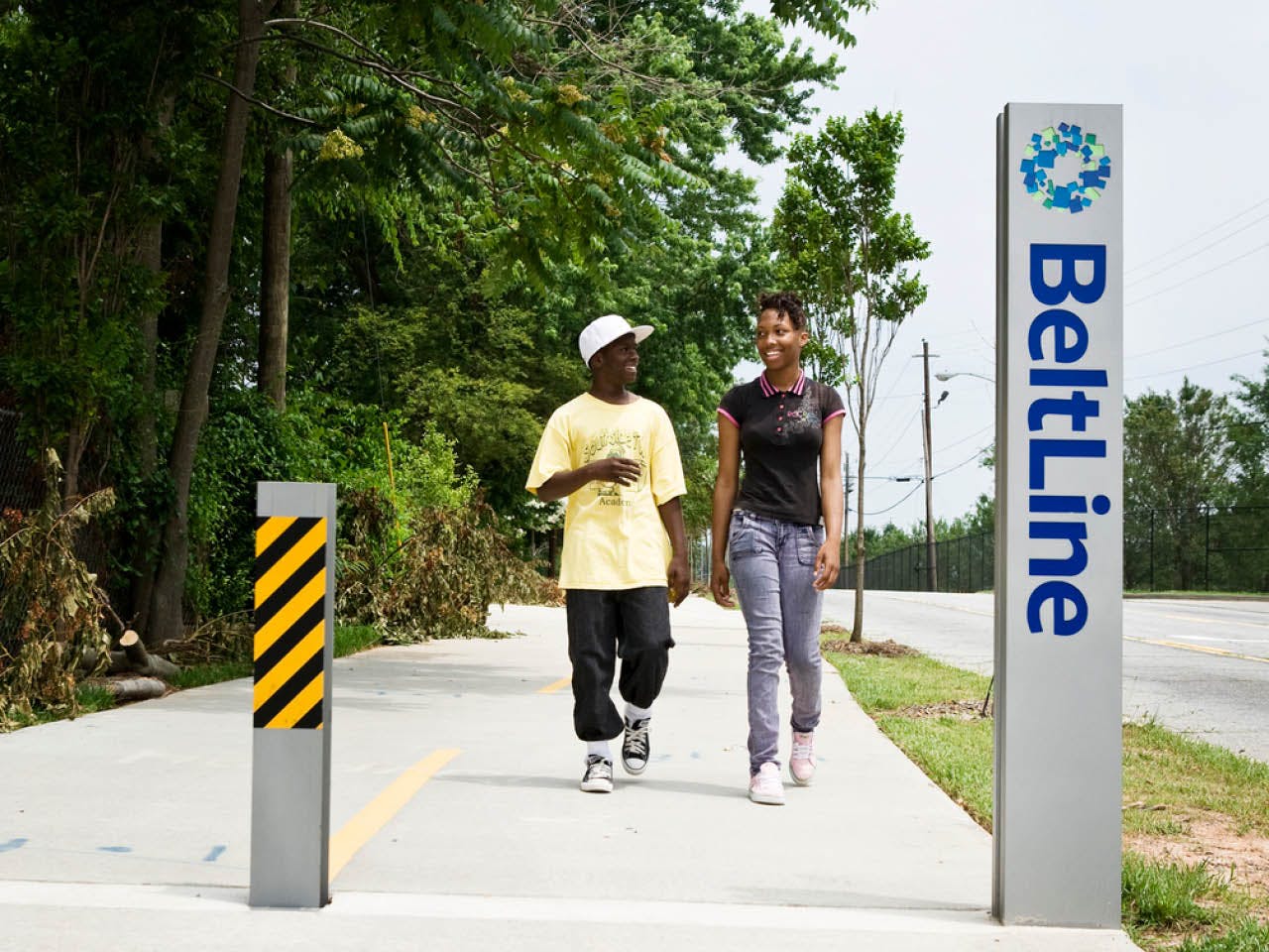 Two people walk down the West End Trail alongside White Street. (Photo Credit: Christopher T. Martin)