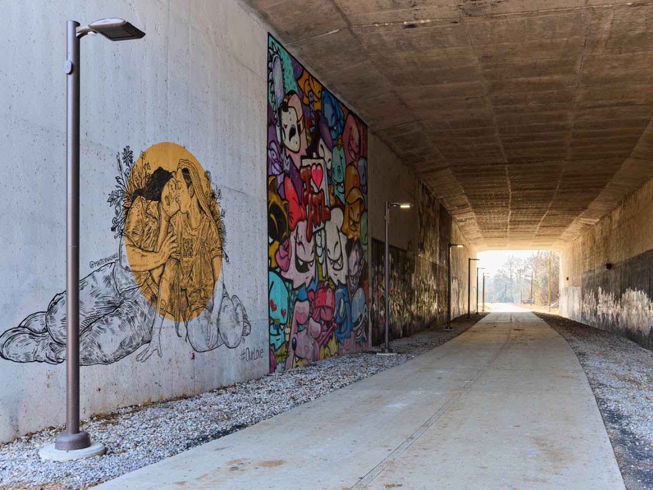 Murals cover the walls of the tunnel under I-85 as part of Art on the Beltline. (Photo Credit: Erin Sintos)