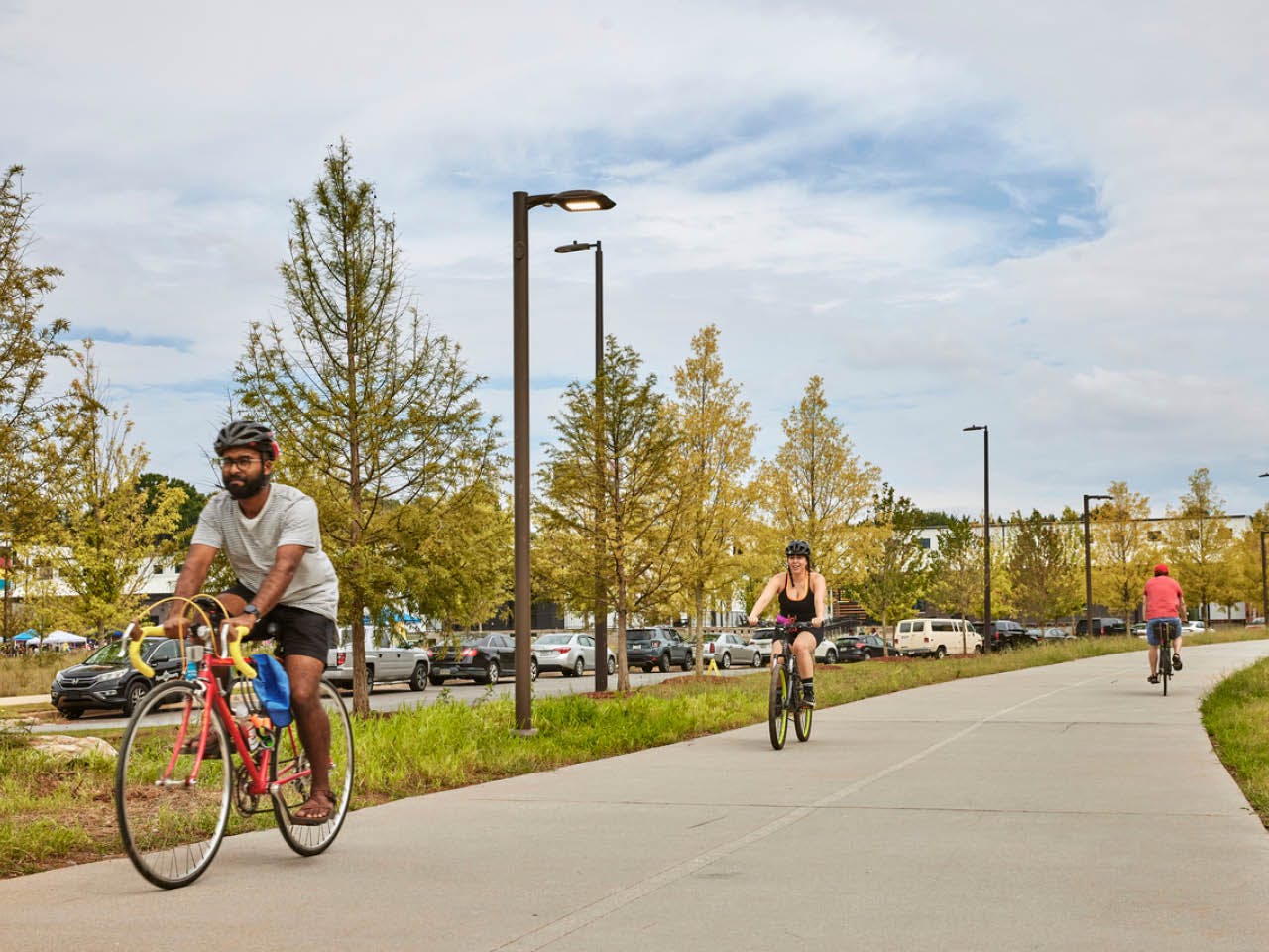 Two cyclists ride on the Atlanta Beltline Southside Trail. Photo by Erin Sintos.