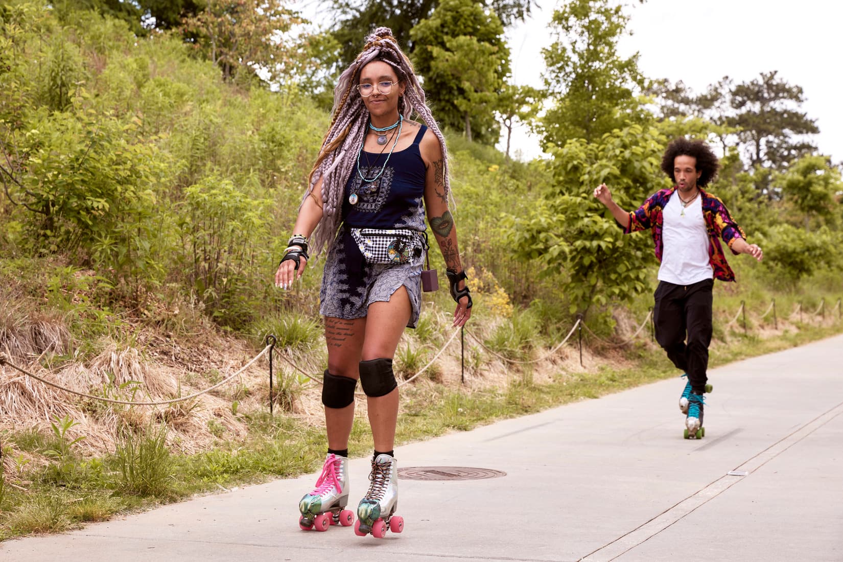 Two people roller skate down the beltline.