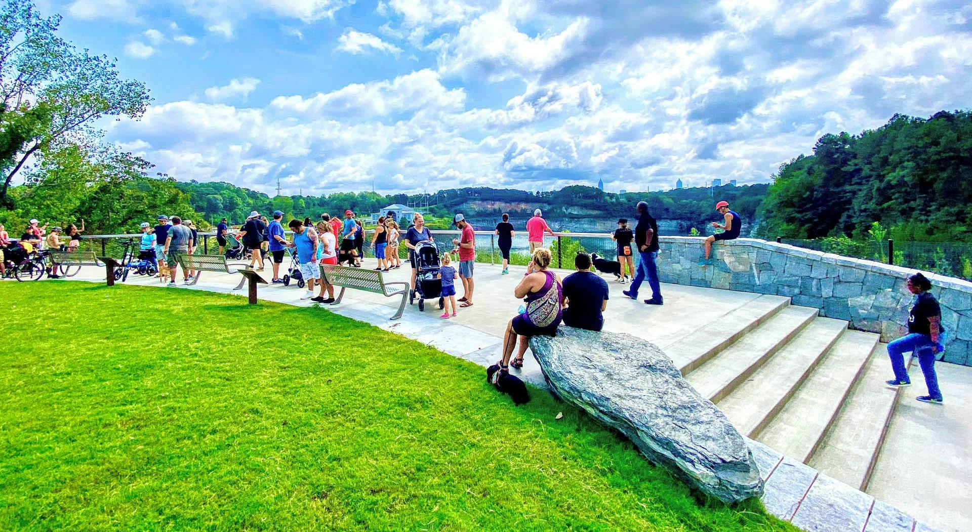 Park visitors overlook the 35-acre water reservoir from a plaza in Westside Park. (Photo Credit: John Becker)