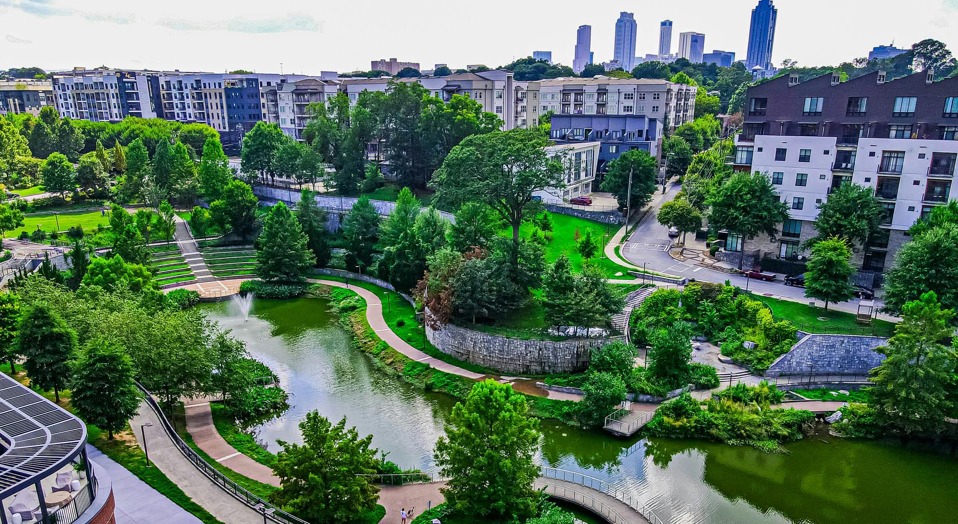 An aerial view of the lake in Historic Fourth Ward Park with the downtown Atlanta skyline in the background. (Photo Credit: LoKnows Drones)