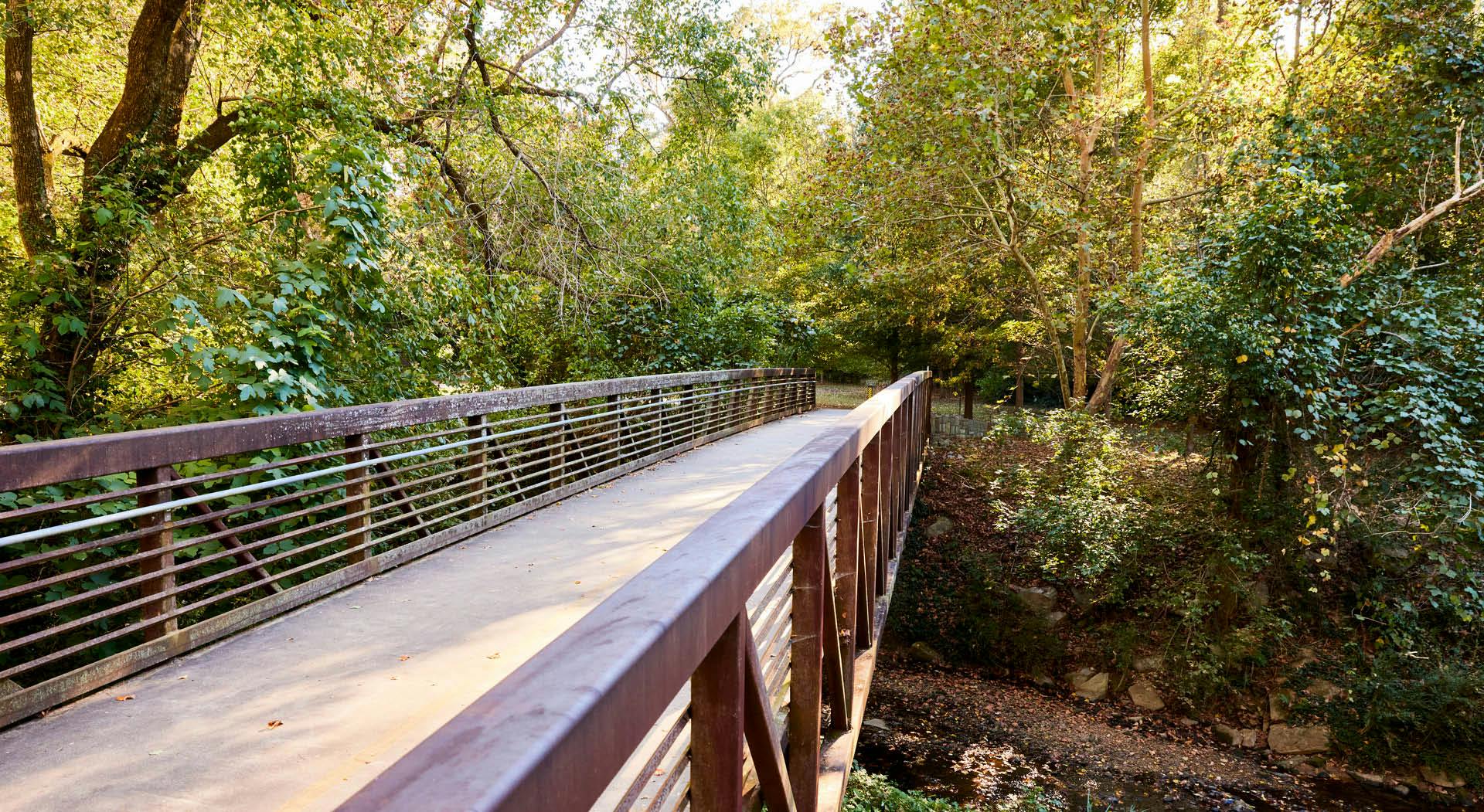 A bridge crosses Tanyard Creek on the Northside Trail.