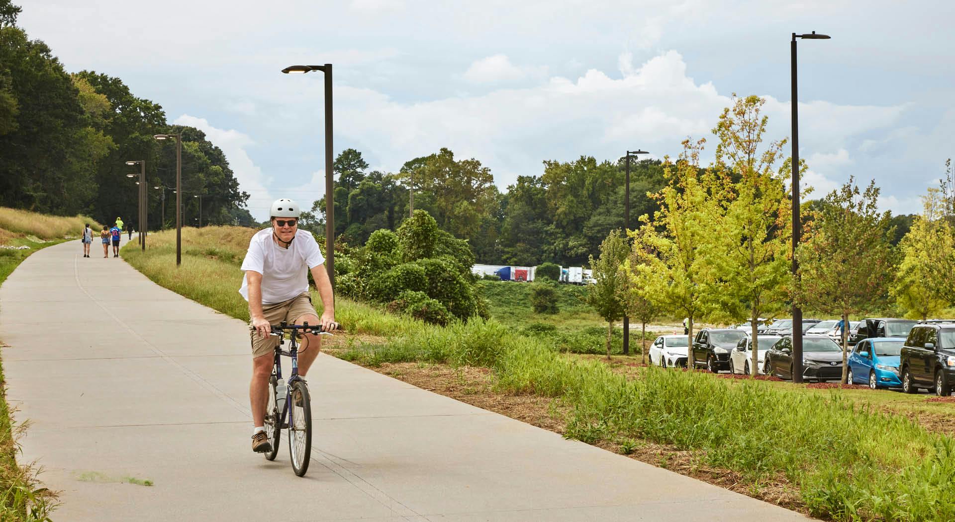 A cyclist rides down the Atlanta Beltline Southside Trail. Photo by Erin Sintos.