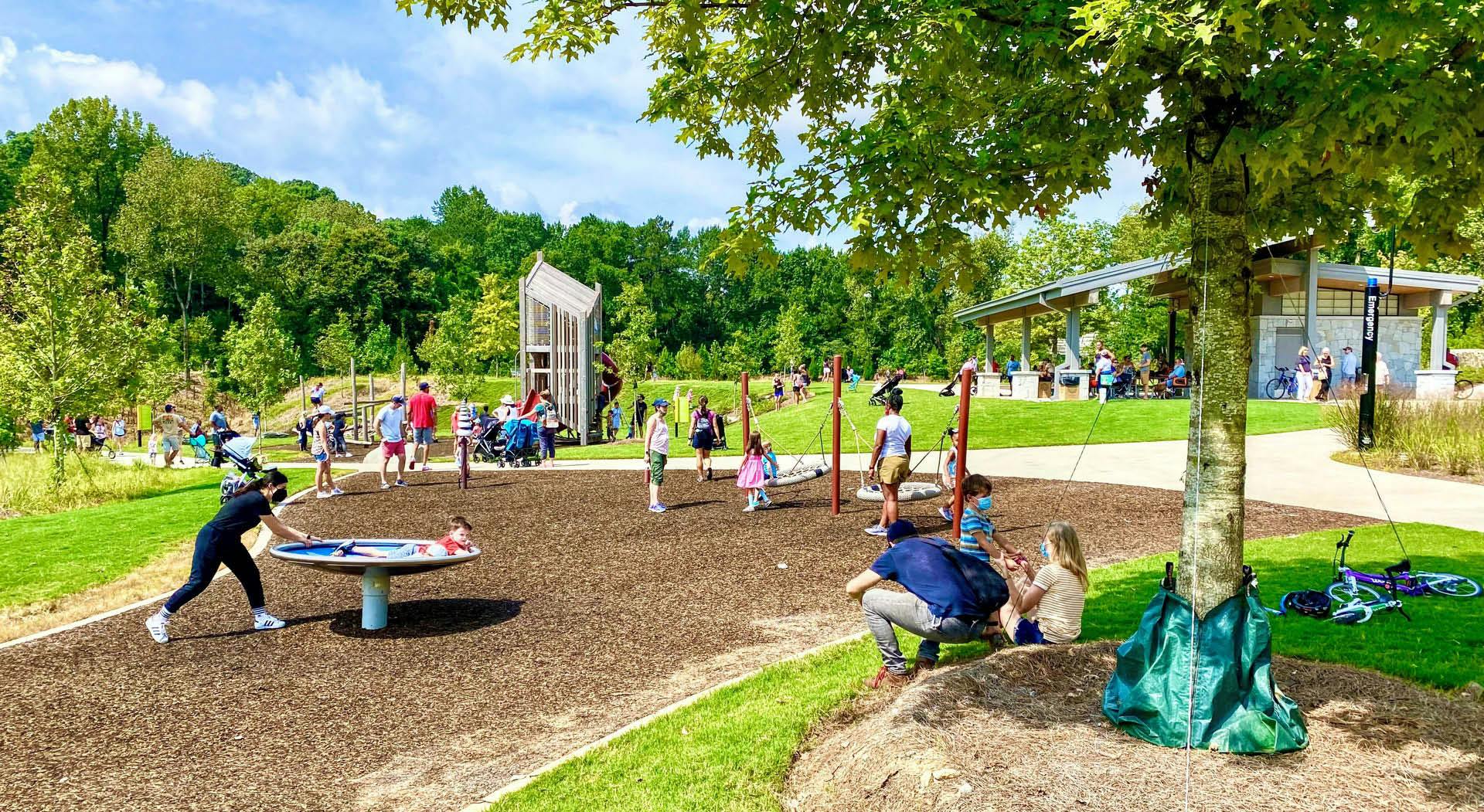 Children and families play on the playground at Westside Park. (Photo Credit: John Becker)