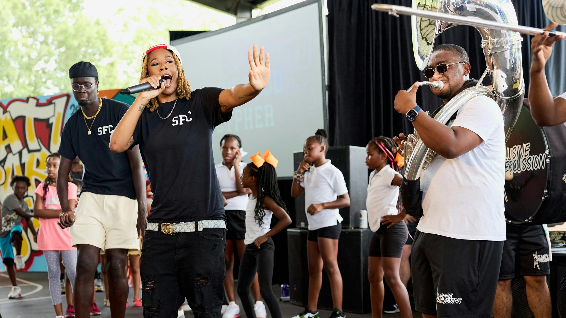 Freestyle Emcee from Soul Food Cypher performs at ATL Park Jam