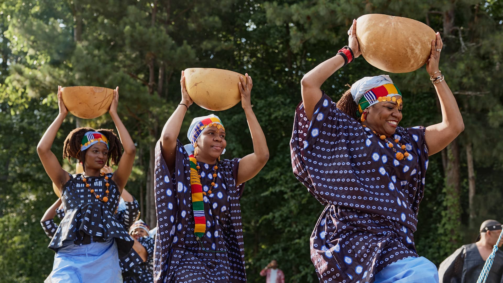 People dance in traditional garb.