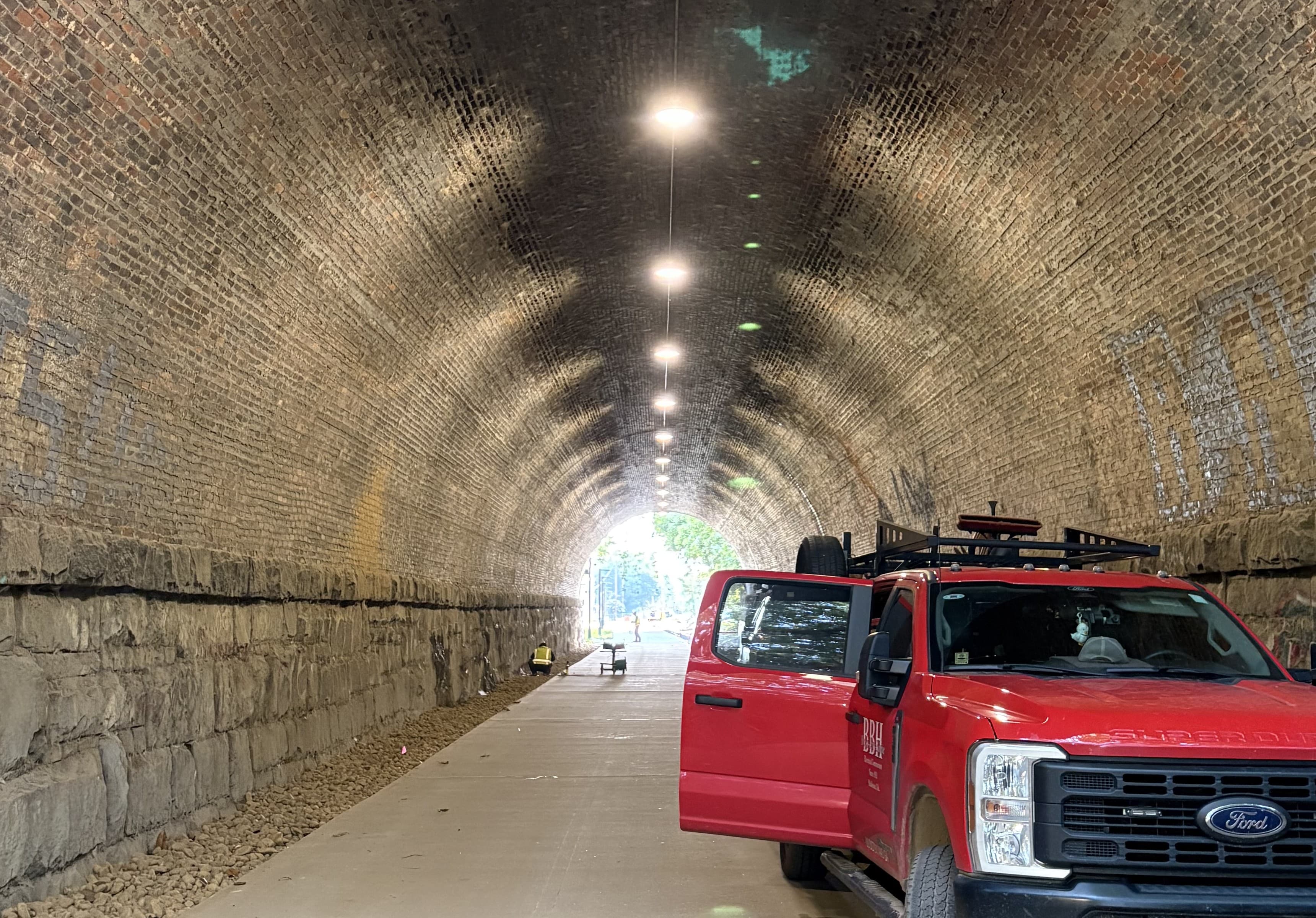 Lighting and concrete trail complete passing through historic rail tunnel. (Photo Credit: ABI Staff)