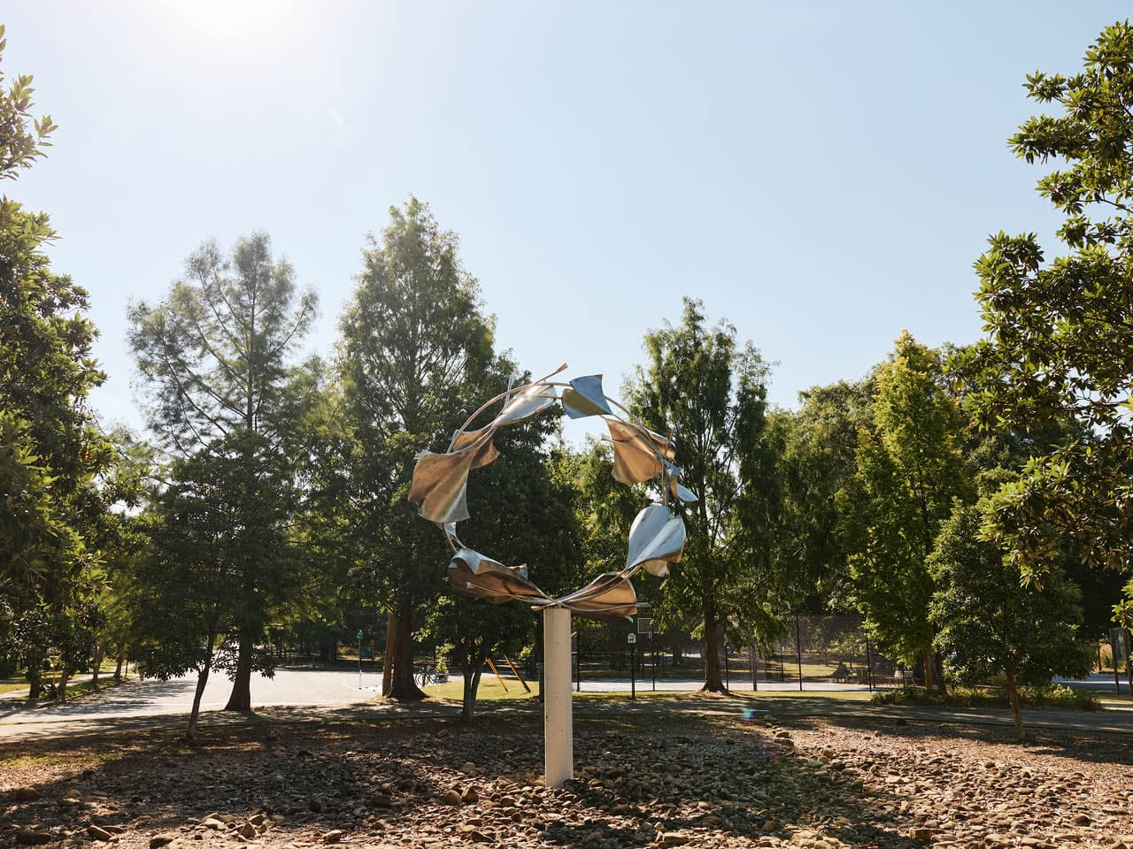 The sculpture "Cycles" by David Landis stands at one end of Rose Circle Park. (Photo Credit: Erin Sintos)