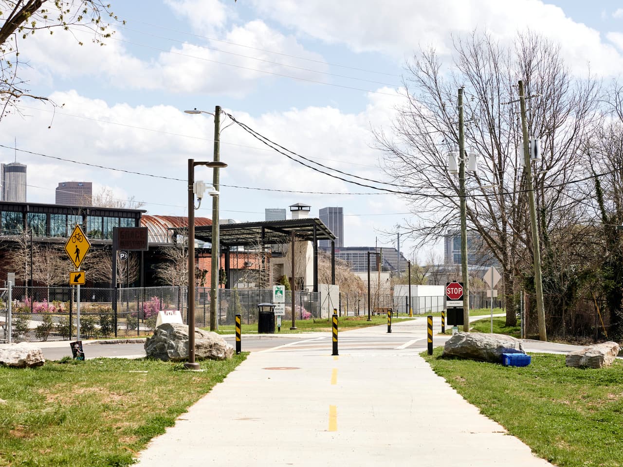 A pathway runs through a busy city intersection.