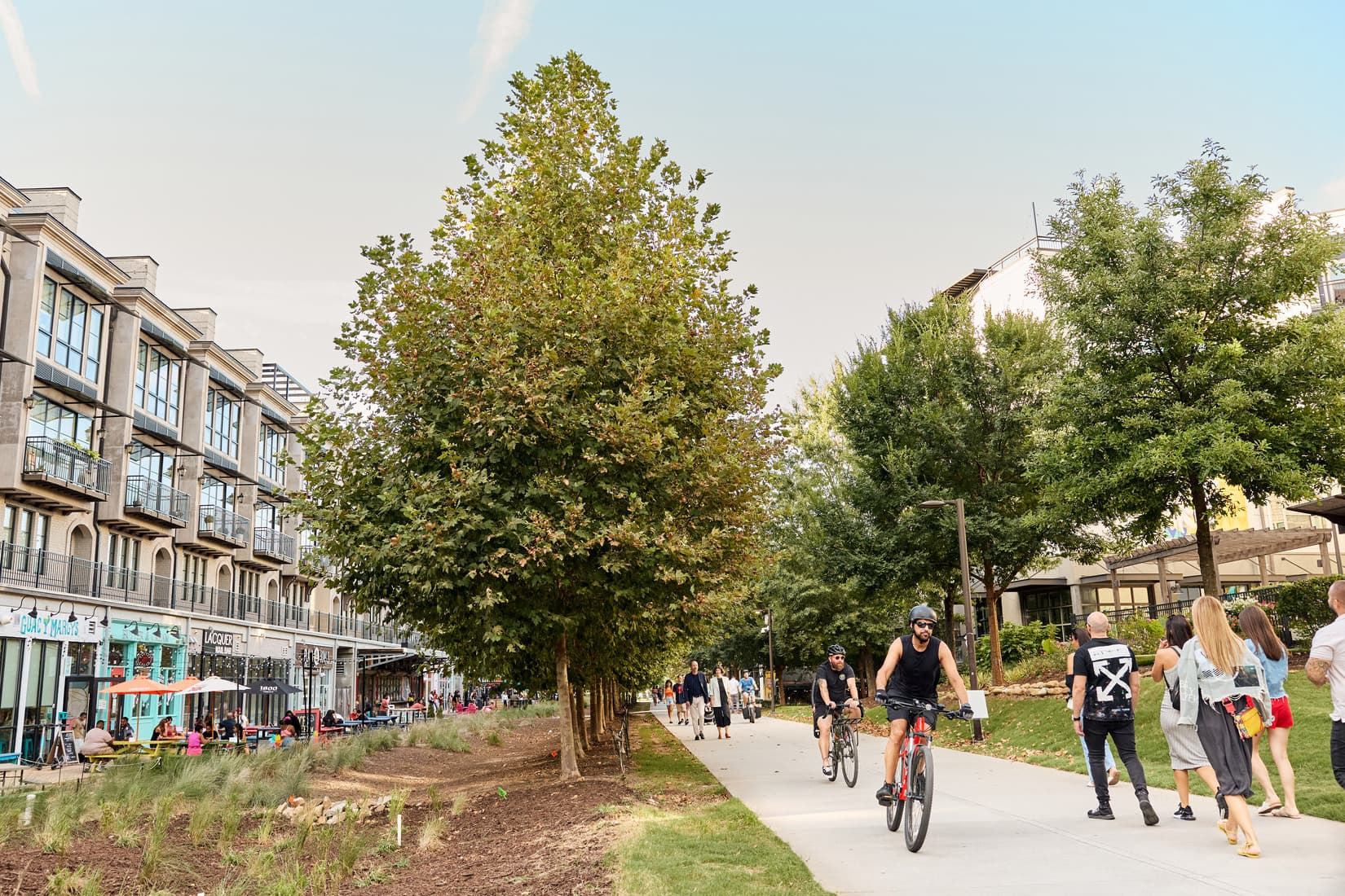 People walk, bike, and scooter down the Beltline.