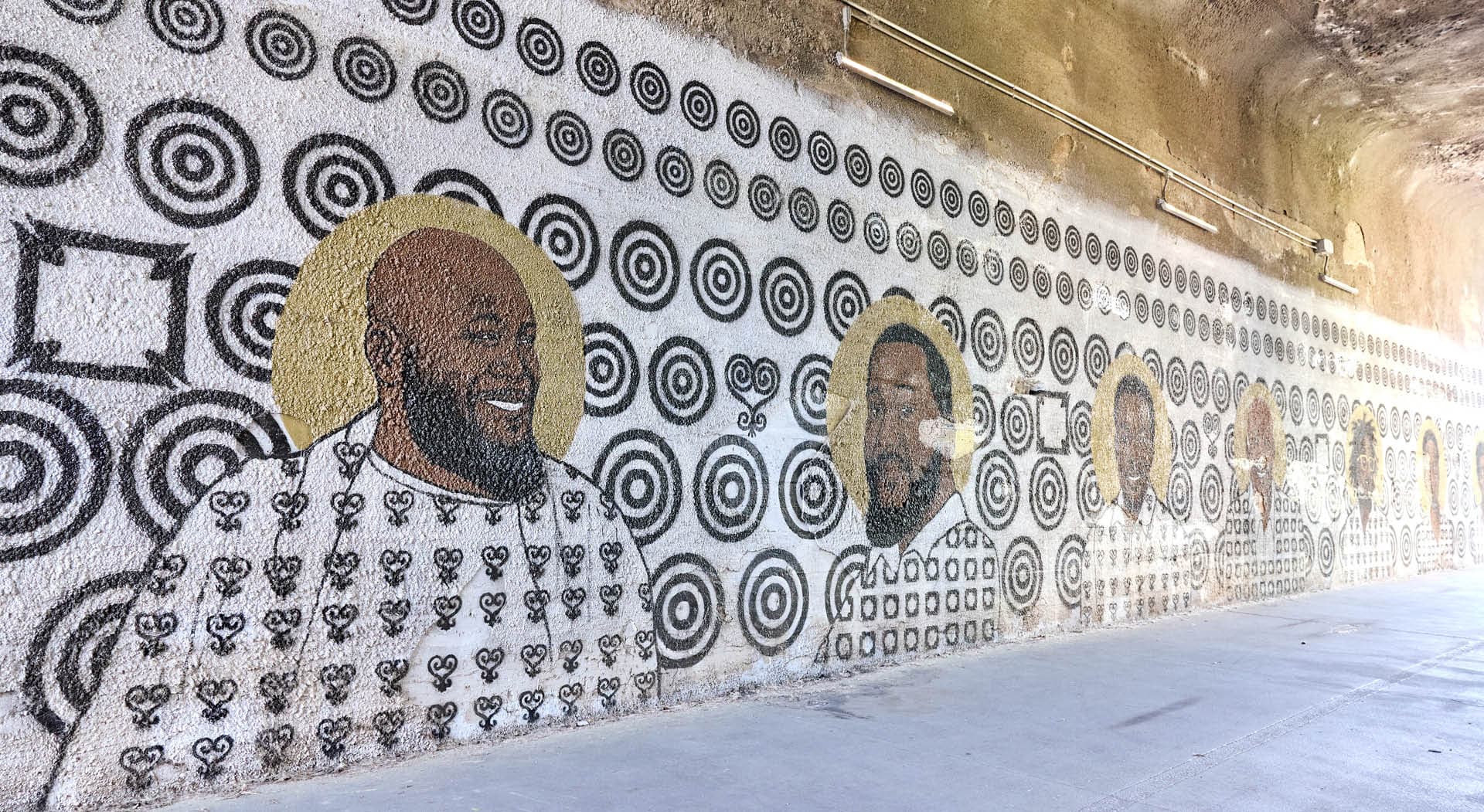 Mural titled Storybox painted on the walls of a tunnel and depicting Black figures of Atlanta's Westside communities. (Photo Credit: Erin Sintos)