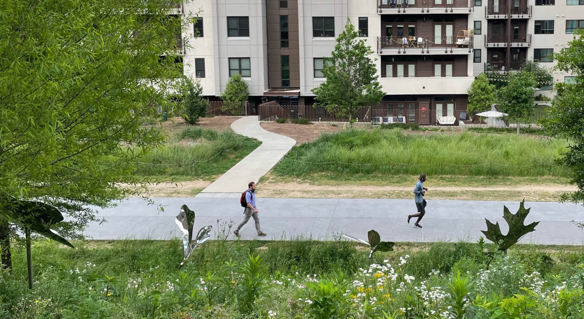 Looking down at the Eastside Trail through stainless steel oak leaf sculptures. (Photo Credit: Atlanta BeltLine, Inc. Staff)