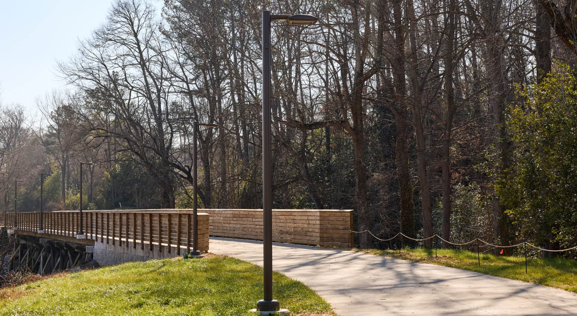 The Northeast Trail crosses Clear Creek on a wooden trestle bridge behind Ansley Mall. (Photo Credit: Erin Sintos)