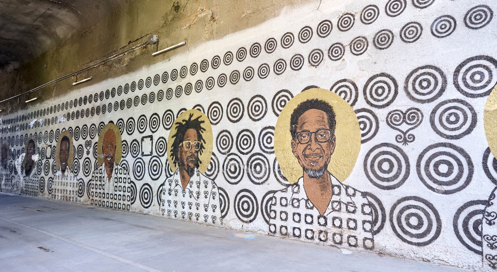 Mural titled Storybox painted on the walls of a tunnel and depicting Black figures of Atlanta's Westside communities. (Photo Credit: Erin Sintos)