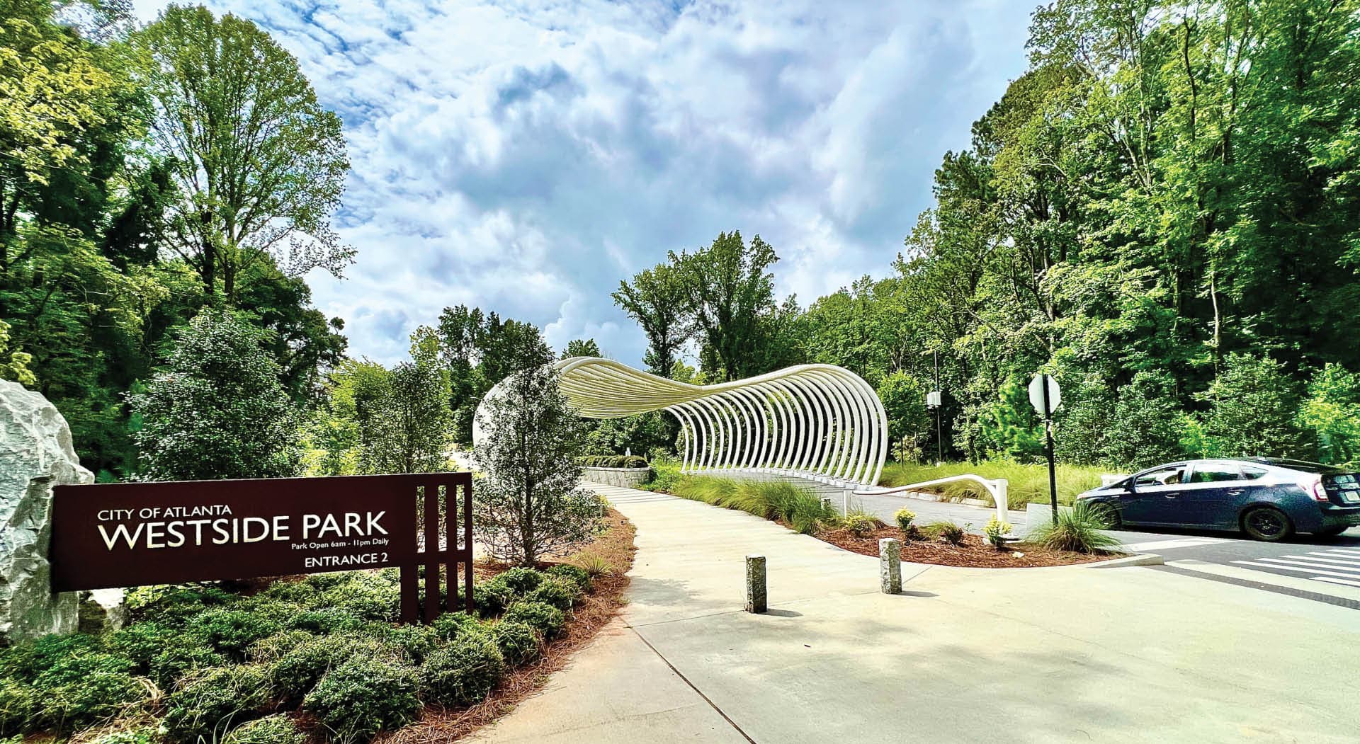 A grand sculpture welcomes visitors at the entrance to Shirley Clarke Franklin Park. (Photo Credit: John Becker)