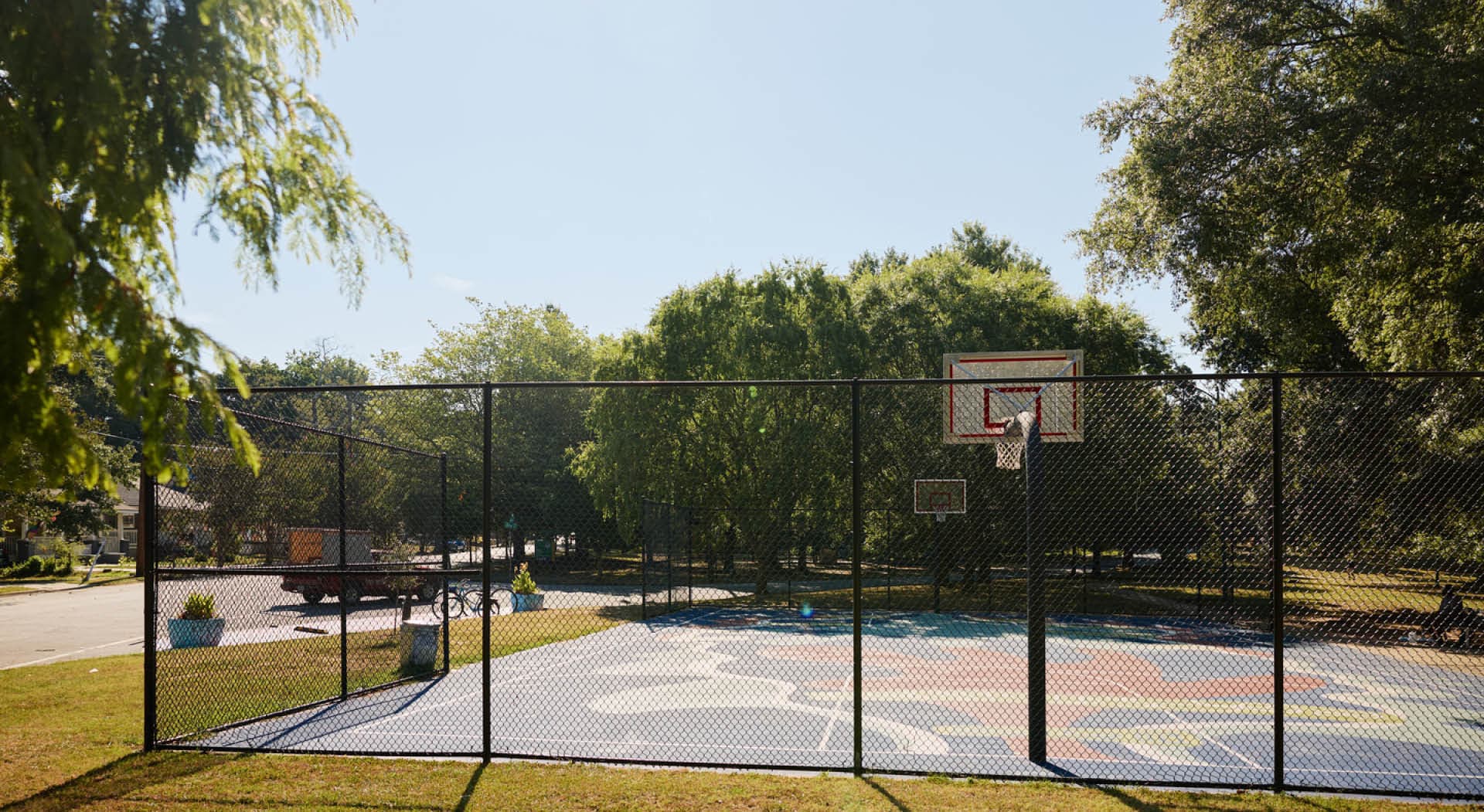 A basketball court with a custom mural at the heart of Rose Circle Park. (Photo Credit: Erin Sintos)