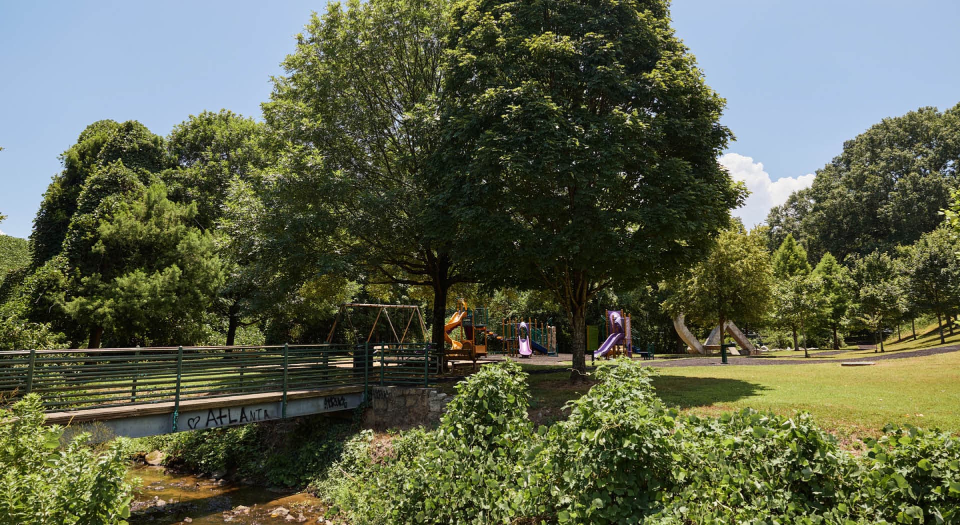 A view of the playground and bridge across the creek. (Photo Credit: Erin Sintos)