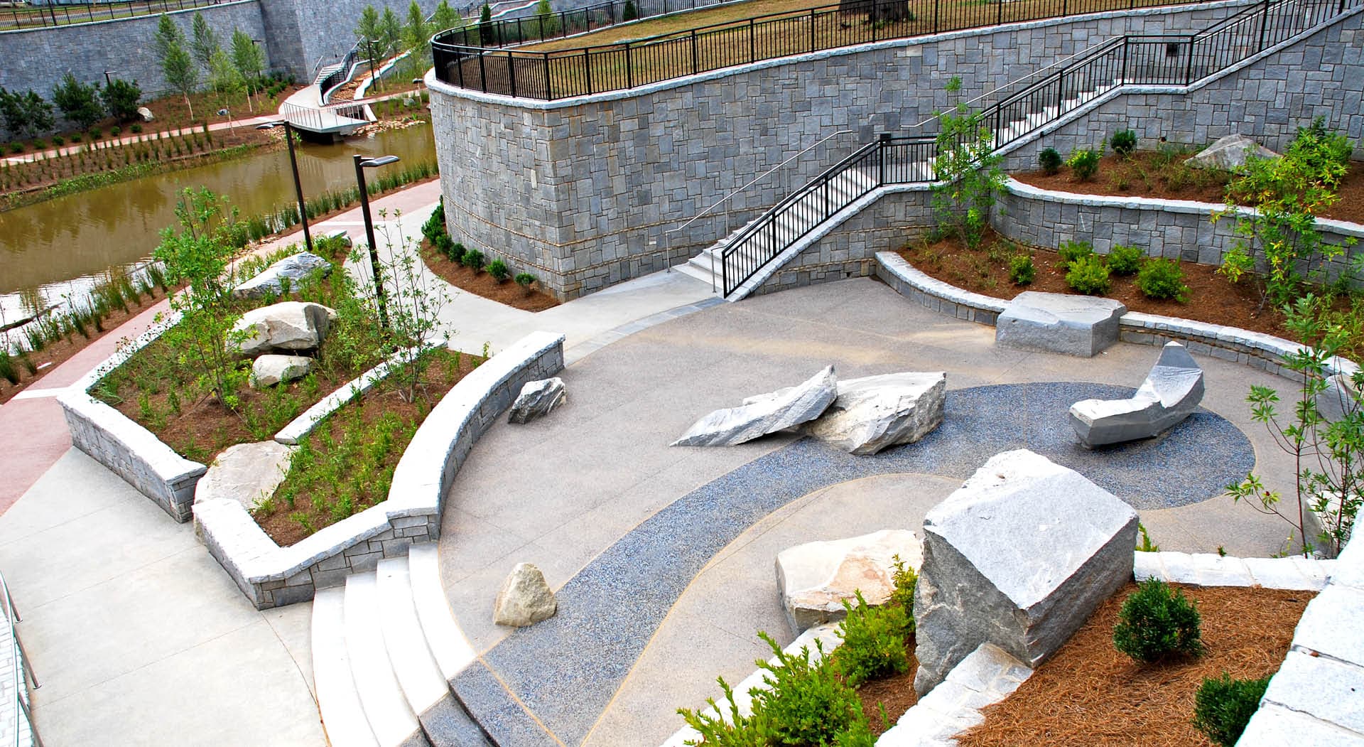 A plaza with granite sculptures made for seating by Maria Artemis.