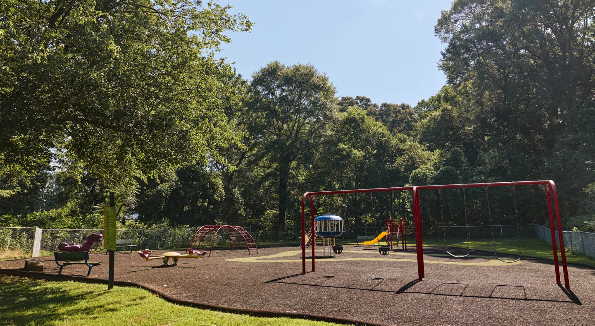 The playground at Enota Place Playlot has a variety of climbing equipment and swings. (Photo Credit: Erin Sintos)