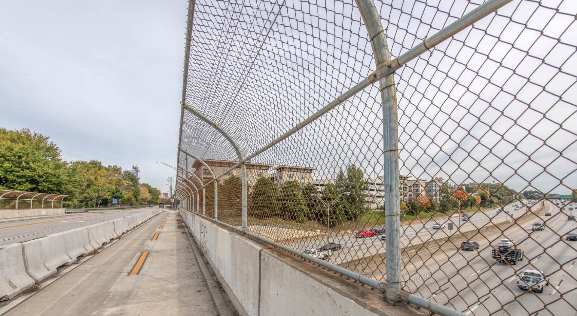Image of the existing bridge over I-20. A new pedestrian bridge will be built adjacent to it. Photo by JandD Images.