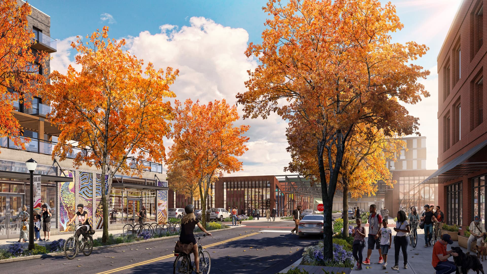 A vibrant street scene with people biking and walking among autumn trees, surrounded by shops and modern buildings under a sunny sky.