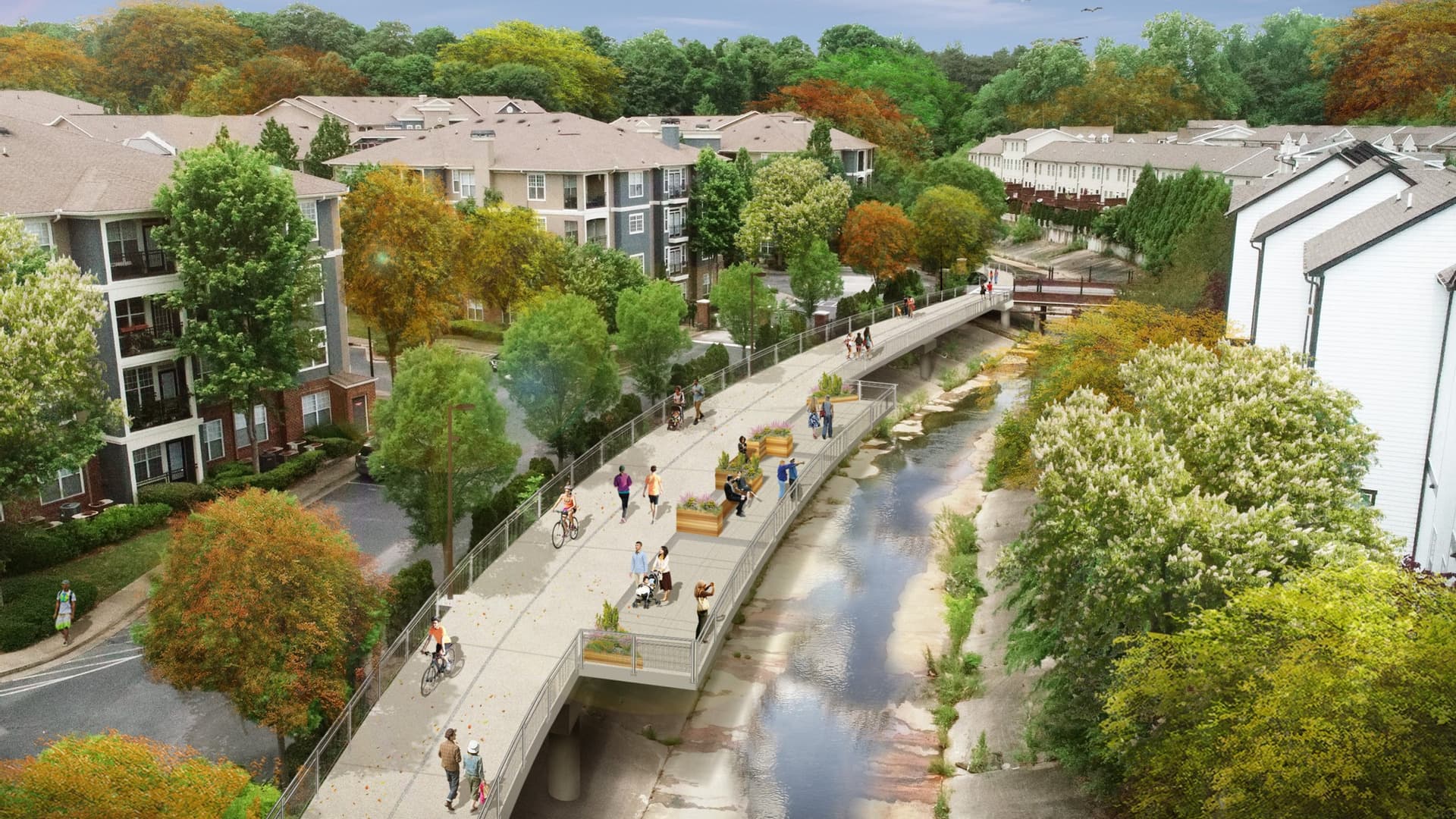 A new, elevated trail runs behind an apartment complex. People are walking and biking along the trail.