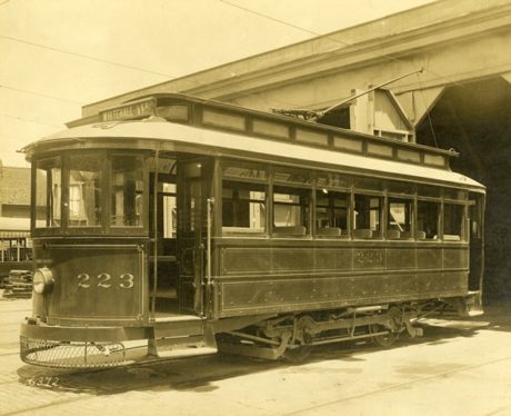 View of streetcar no. 223, with a sign showing a Whitehall Street-Lee Street route, at a carbarn in Atlanta, Georgia. Photo credit: Kenan Research Center at Atlanta History Center.