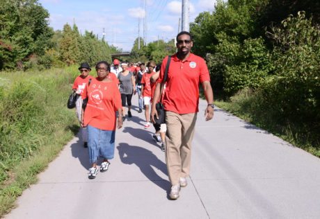 City Councilman Dickens leads seniors from Piedmont Park to Ponce City Market on the Eastside Trail.