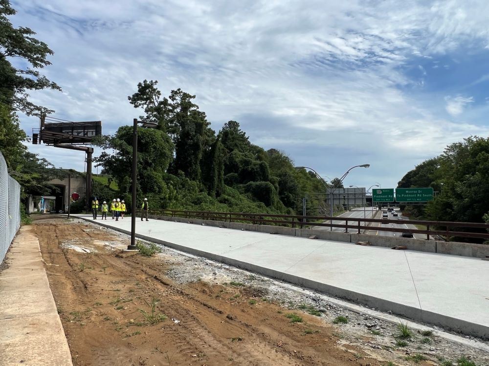 Northeast Trail - Seg. 2 construction as it passes over the Buford-Spring Connector. The tunnel under I-85 can be seen to the left. July 21, 2023.
