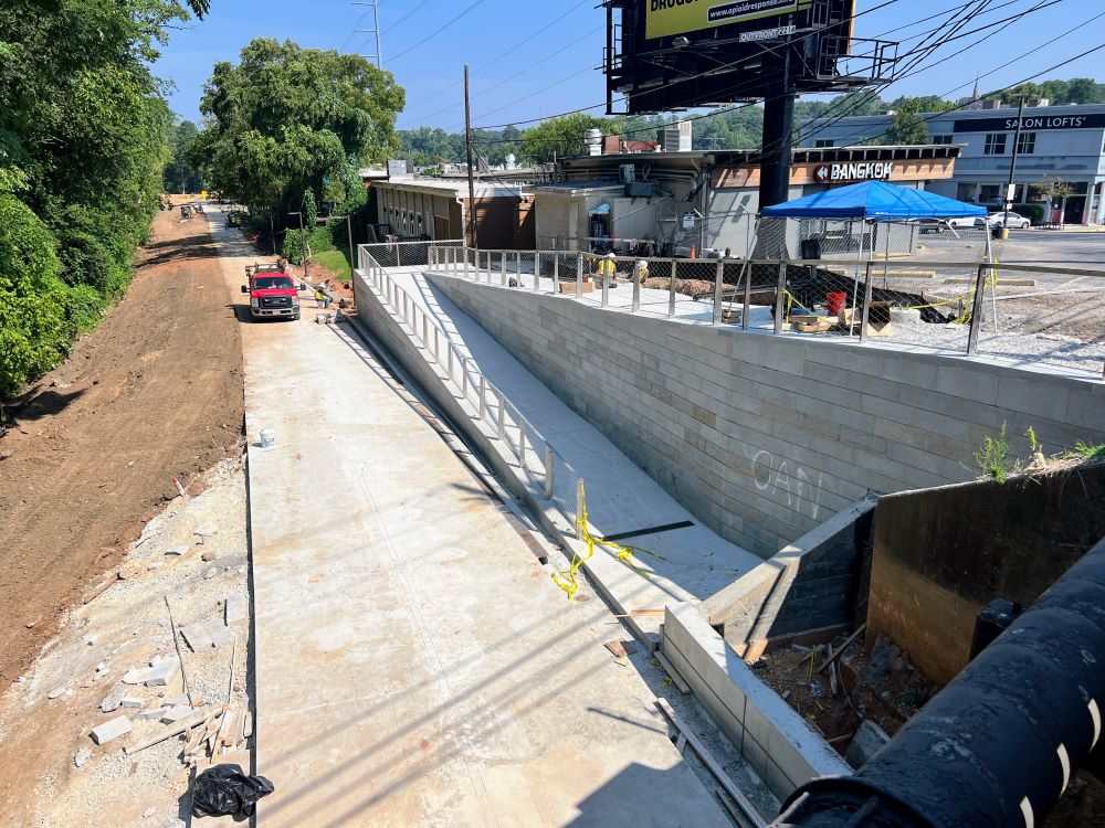 Concrete pouring complete on the ramp between the Northeast Trail and Piedmont Avenue. August 23, 2023. Photo by John Becker.