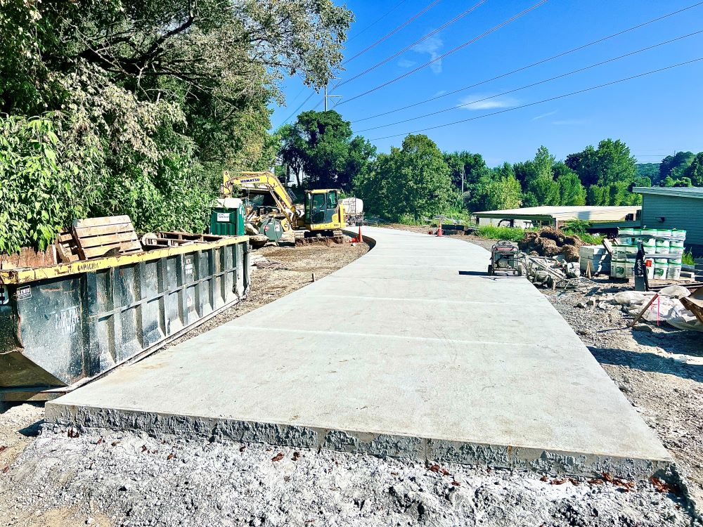 The trail is poured nearly to Westminster Drive. August 27, 2023. Photo by John Becker.
