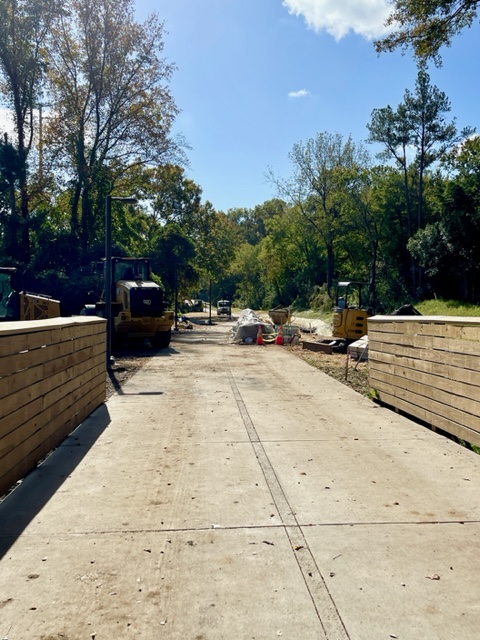 Construction crews working on a bridge and sidewalk connection to Ansley Mall, just south of the Clear Creek bridge on Northeast Trail - Segment 2. This work is being completed by Selig Enterprises, the owner of Ansley Mall. October 26, 2023. Photo by Kerri Parker.