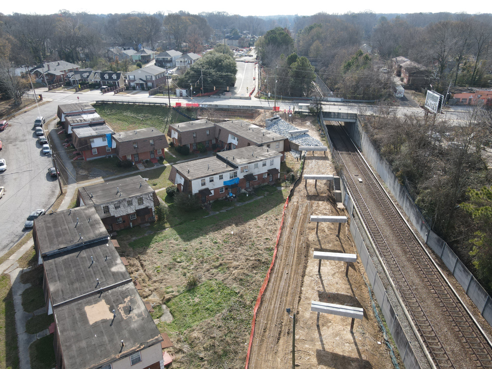 Westside Trail - Segment 4: looking south alongside Azalea Gardens Apartments towards Joseph E. Boone Boulevard. Mayson Turner Road has been closed and will be converted to the trail. December 21, 2023. Photo by LoKnows Drones.