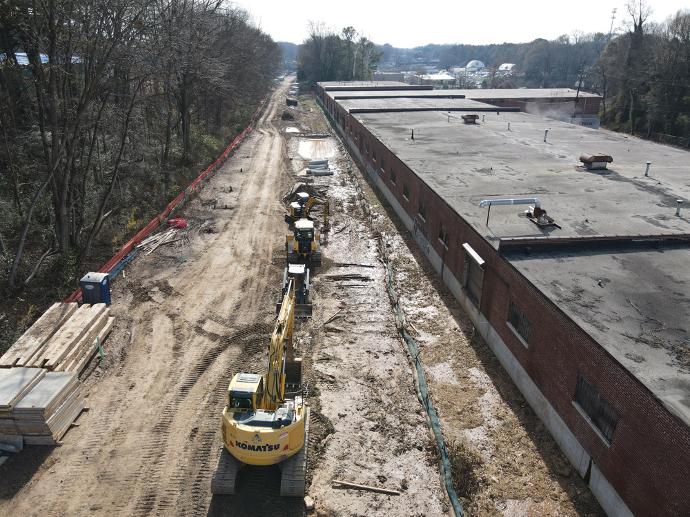 Westside Trail - Segment 4: looking south behind the warehouses south of Hollowell Parkway. December 21, 2023. Photo by LoKnows Drones.