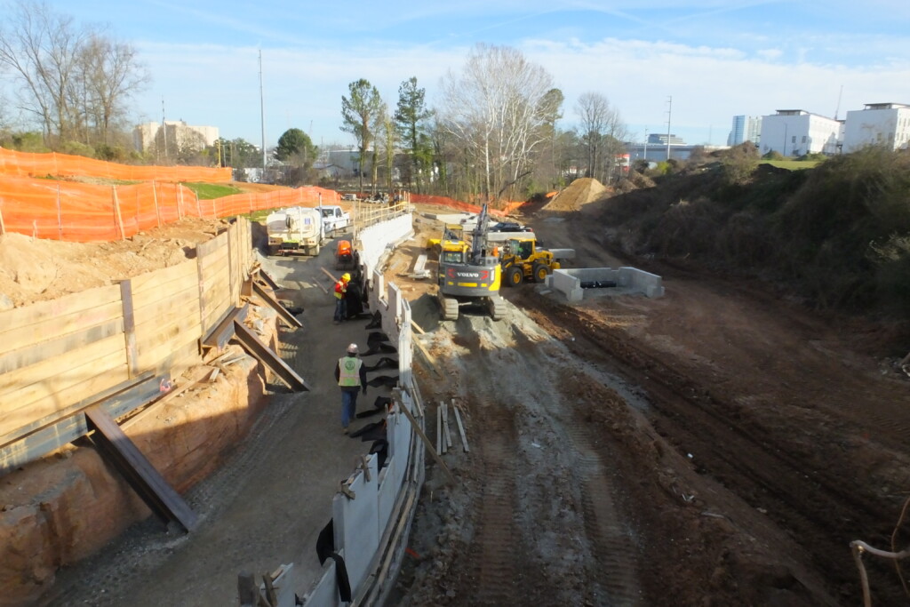 Westside Trail – Segment 4: construction underway for a access ramp from the trail up to Donald Lee Hollowell Parkway NW. View towards the completed Westside Connector Trail and Westside Segment 3.