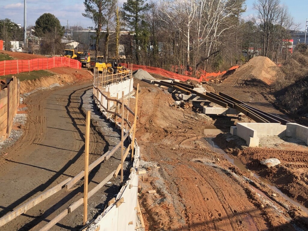 New access ramp from Donald Lee Hollowell Parkway, NW, facing towards the BeltLine Westside Connector Trail. Steel has been delivered and is ready for an elevated section of trail to the right side of the image. January 24, 2024.
