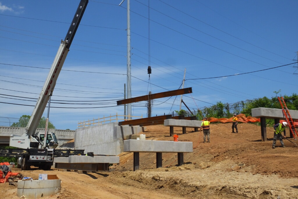Installation of beams at a ramp that will provide access to Donald Lee Holloway Parkway NW. Photo taken 04/25/2024. Photo by Kerri Parker.